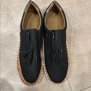 Black Leather slip on casual women’s shoe.
